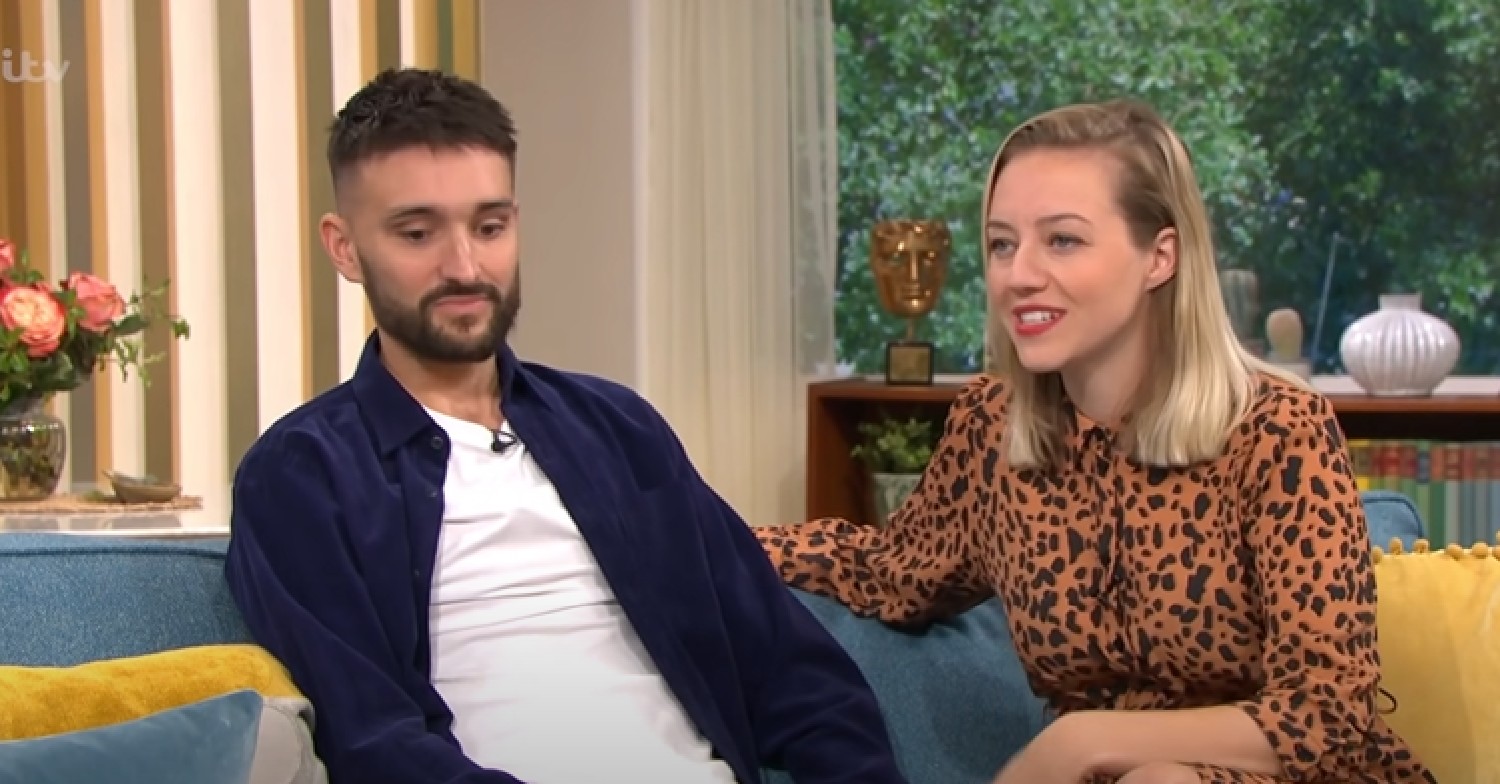 Tom Parker looking down with wife Kelsey on This Morning