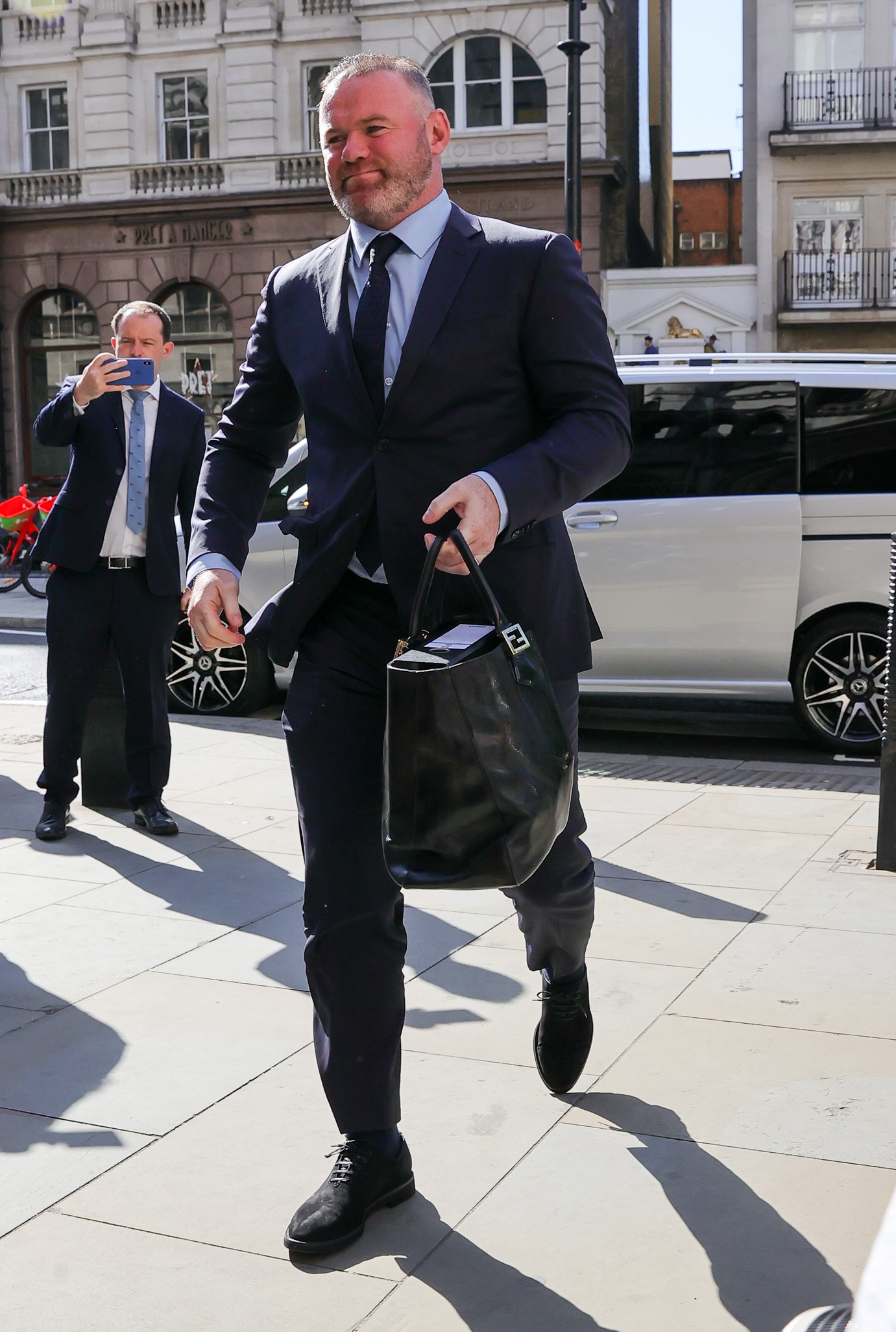 Wayne Rooney in suit arriving at court for Coleen Rooney trial