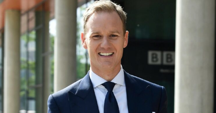 Dan Walker smiling in a suit