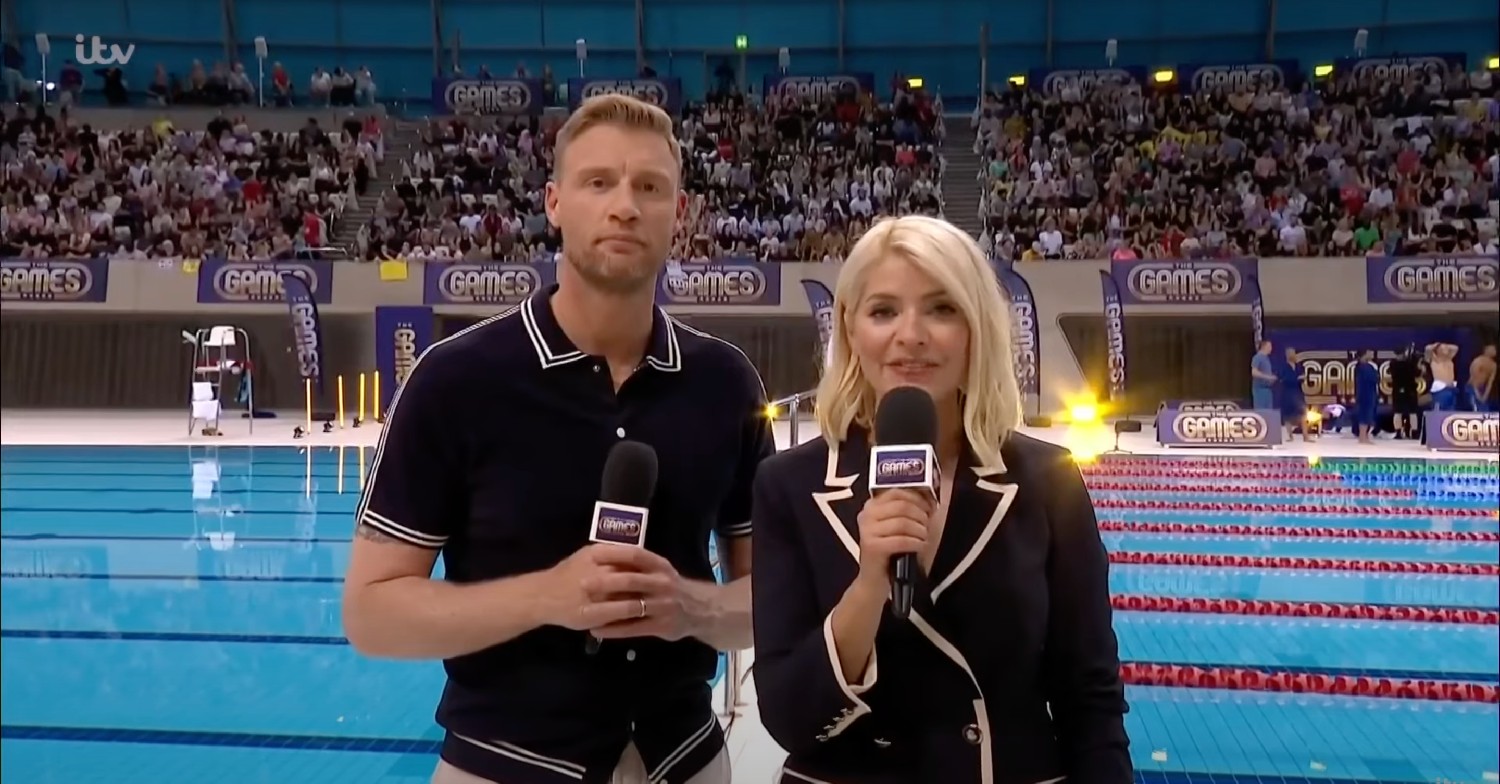Holly Willoughby and Freddie Flintoff presenting poolside, speaking to the camera in The Games