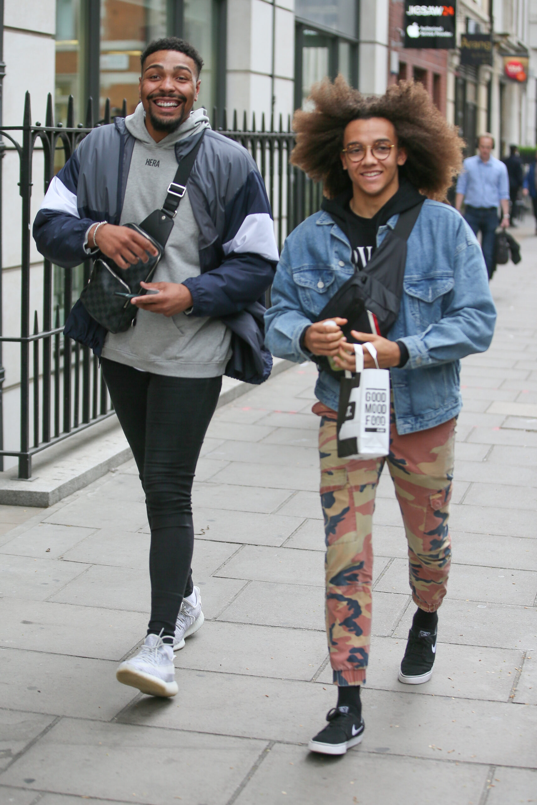 Jordan Banjo smiling with his KISS FM's breakfast show Perri 