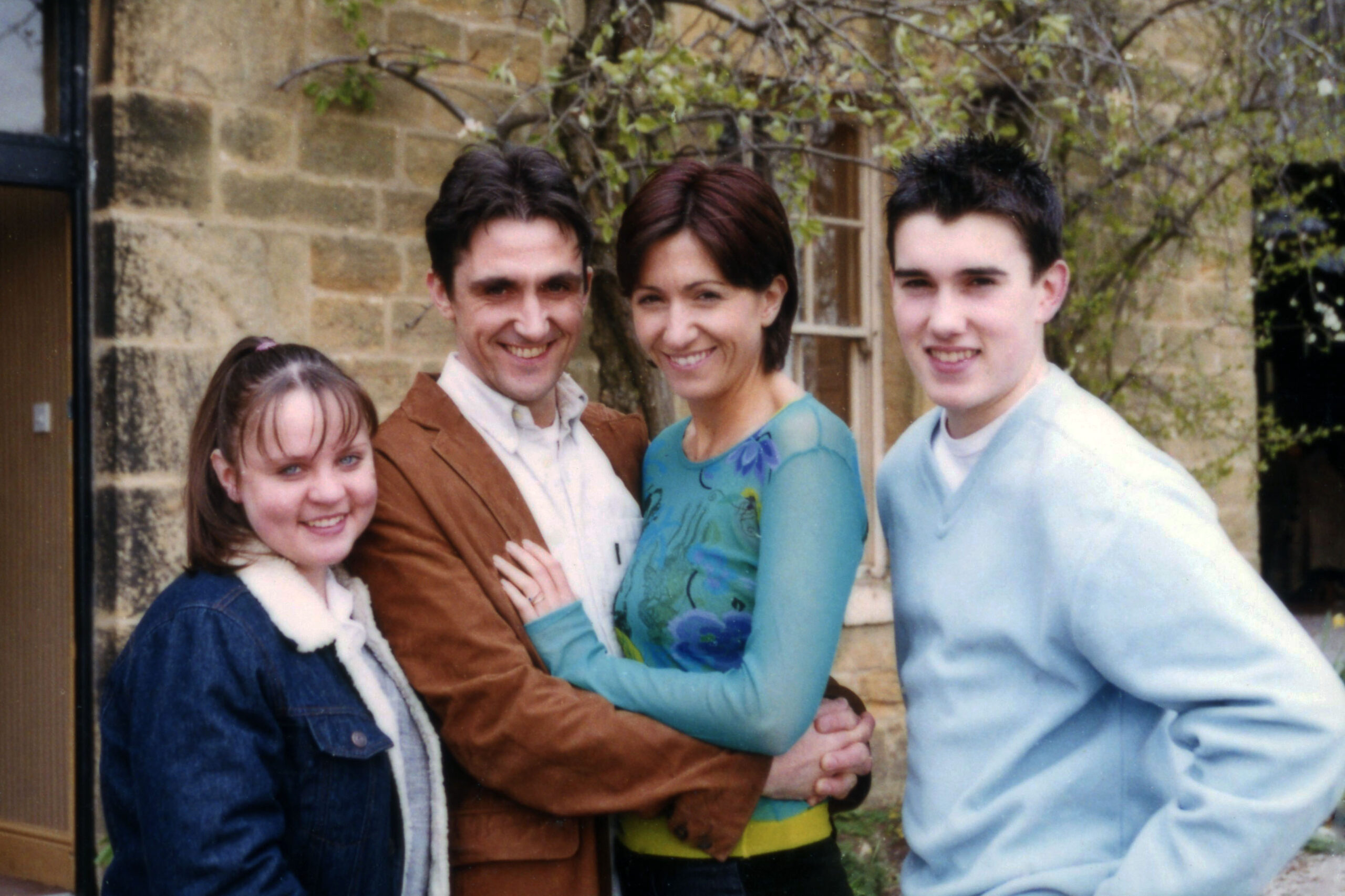 Ollie, Sean, Angie and Marc Reynolds smiles for a family picture in Emmerdale
