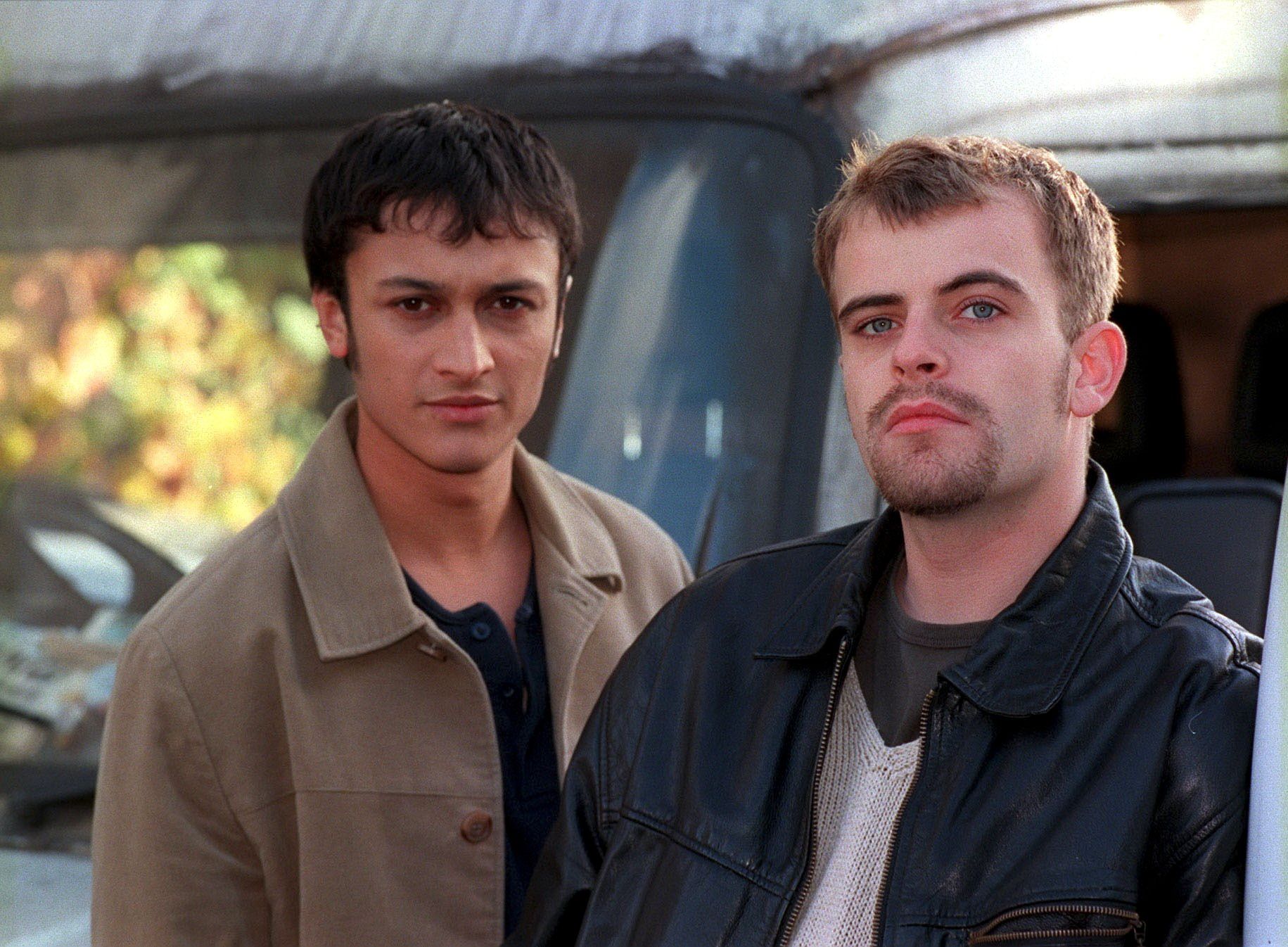 Vikram Desai and Steve McDonald stare into the camera in classic Coronation Street