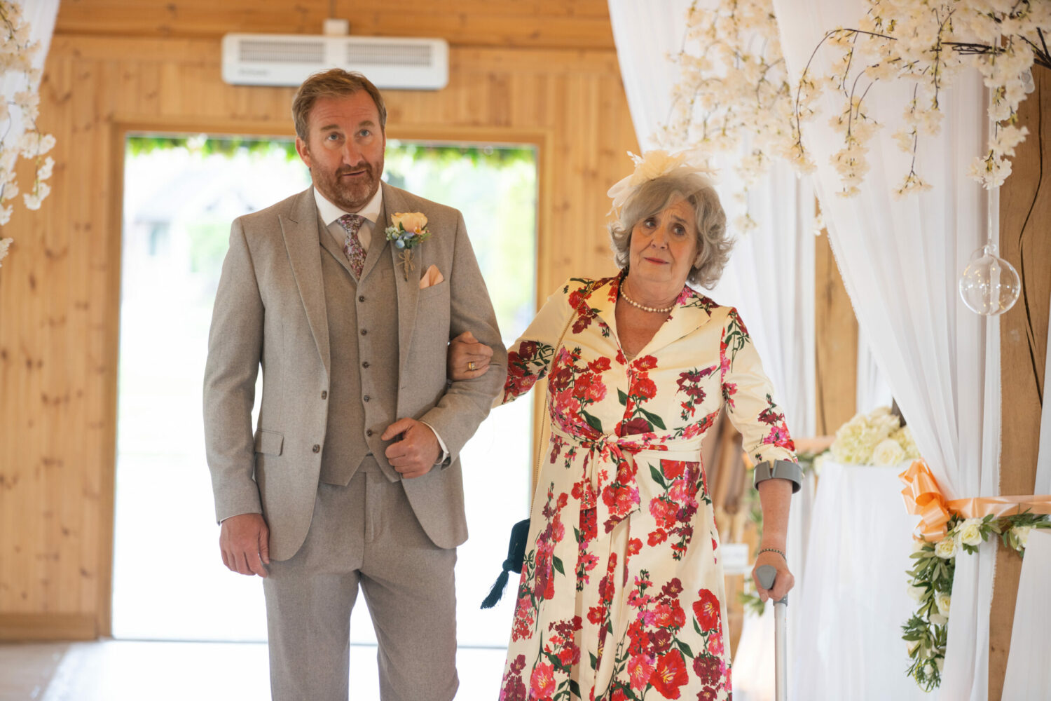 Phill and Mimi walking down the aisle Coronation Street