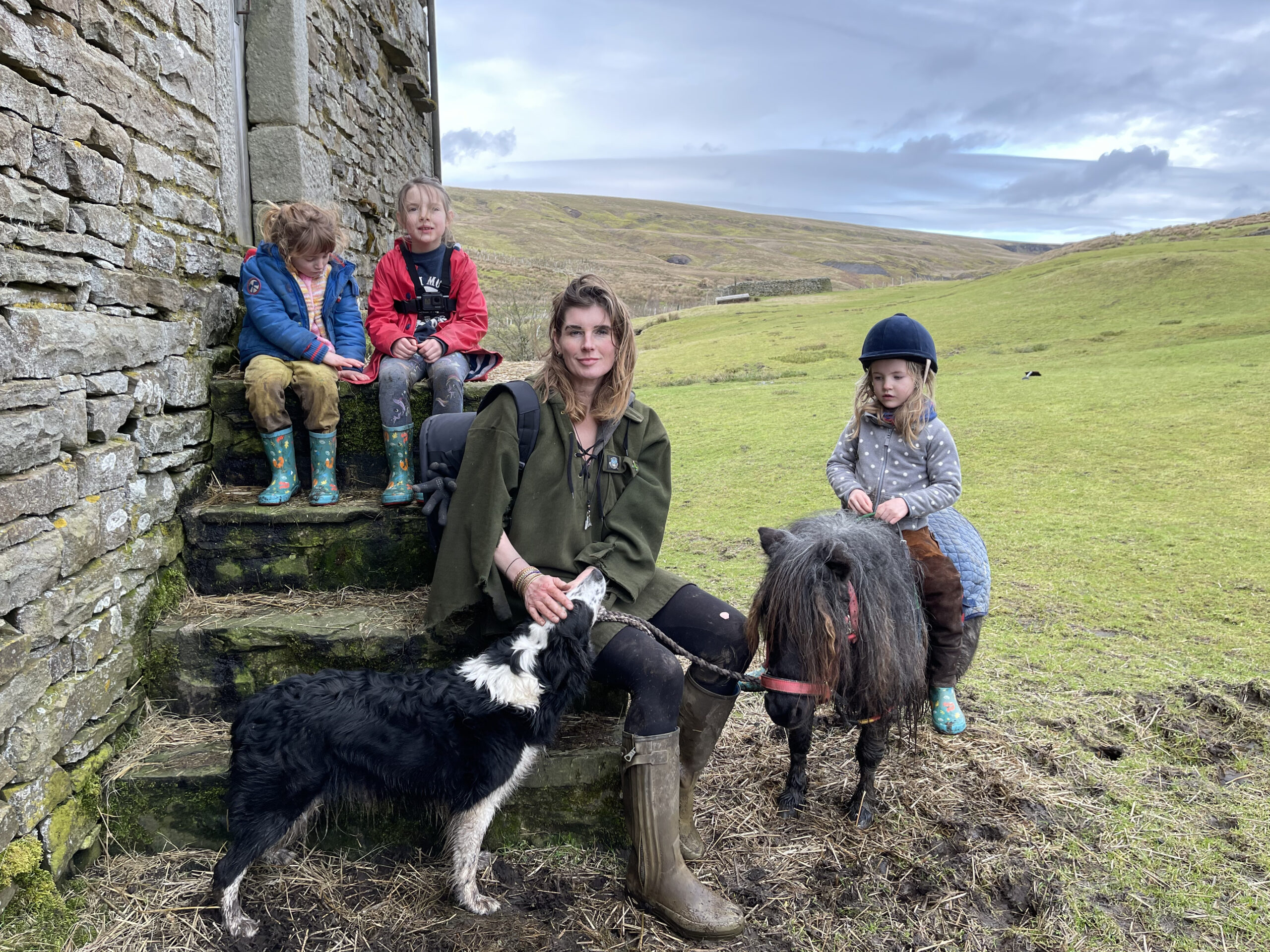 Amanda Owen with the kids on her farm