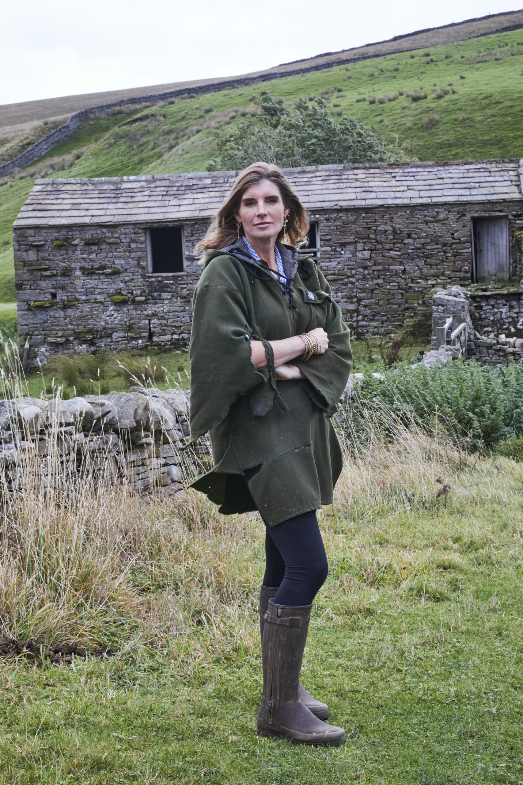 Amanda Owen standing in the wind on her farm