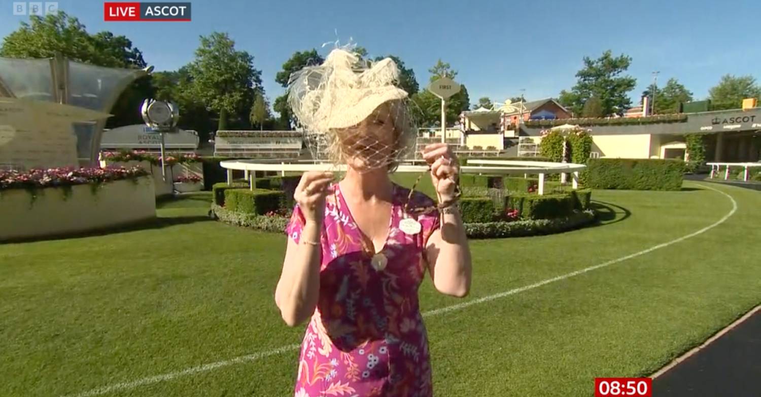 Carol Kirkwood pulls down her hat veil