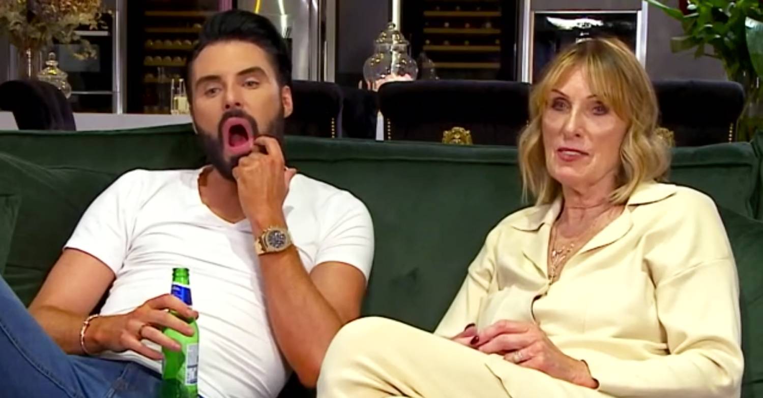 Celebrity Gogglebox star Rylan rubs his face and his mum Linda sits next to him