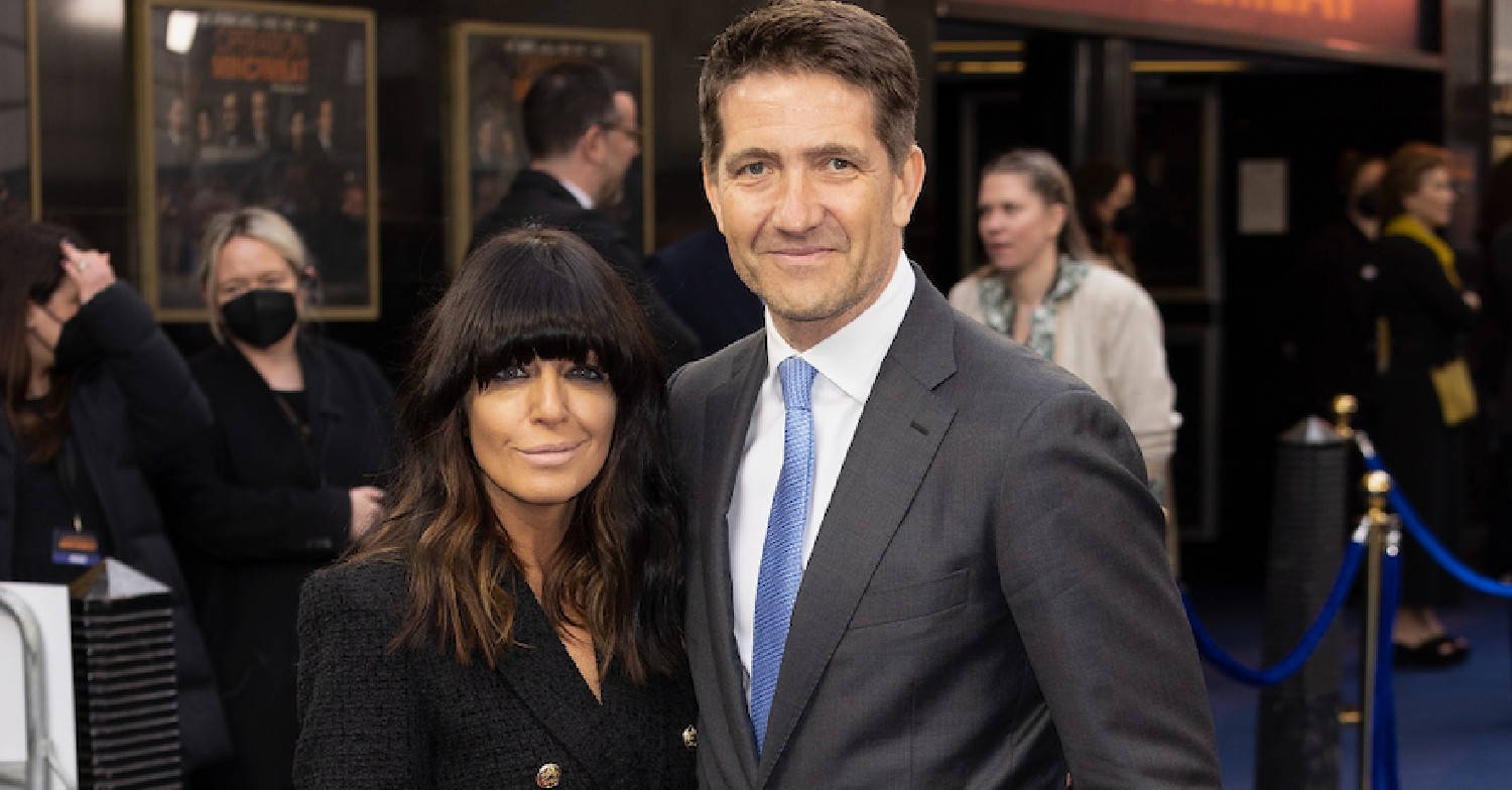 Claudia Winkleman and her husband Kris cuddling on red carpet