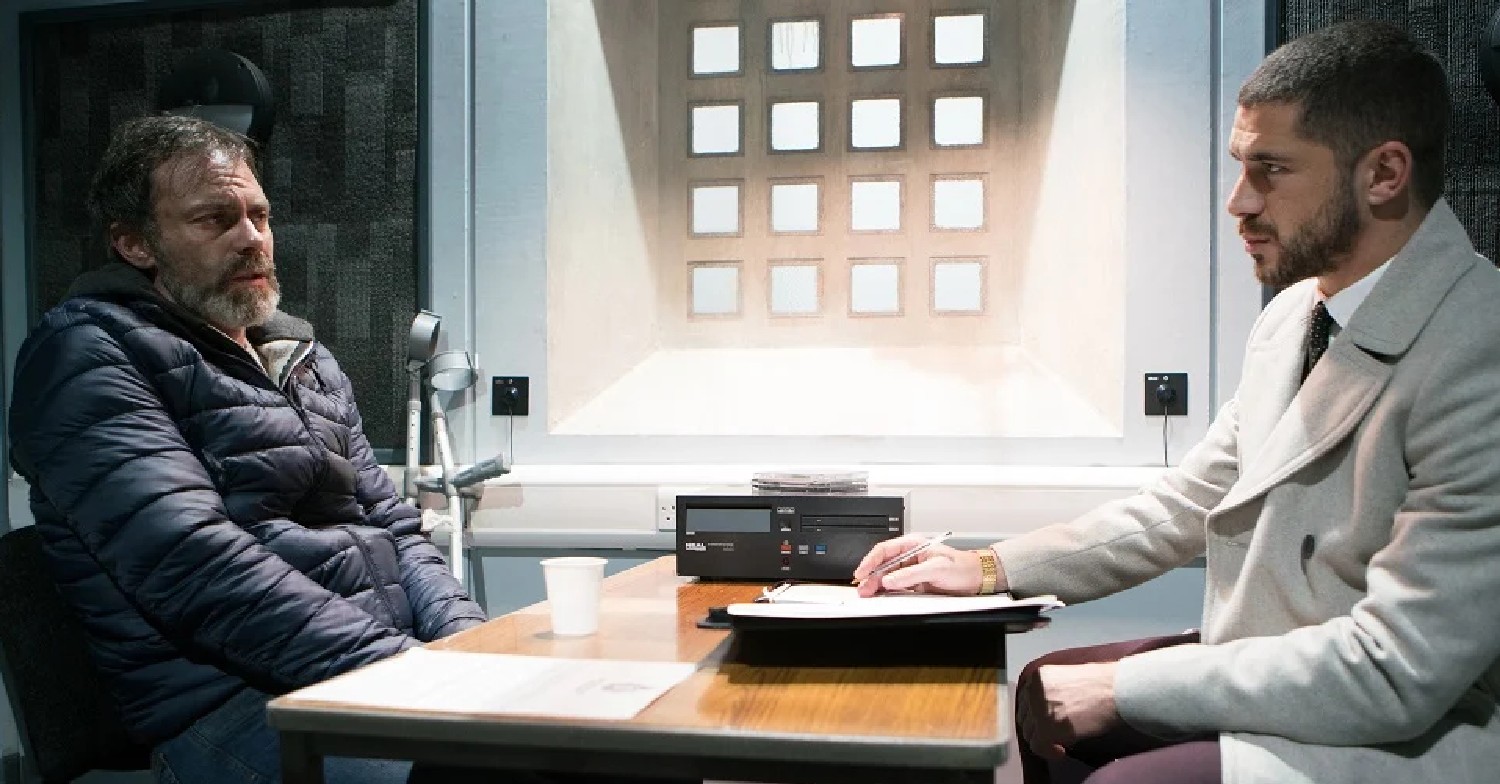 Corrie Billy looks scared and ill as Adam talks to him in the interview room