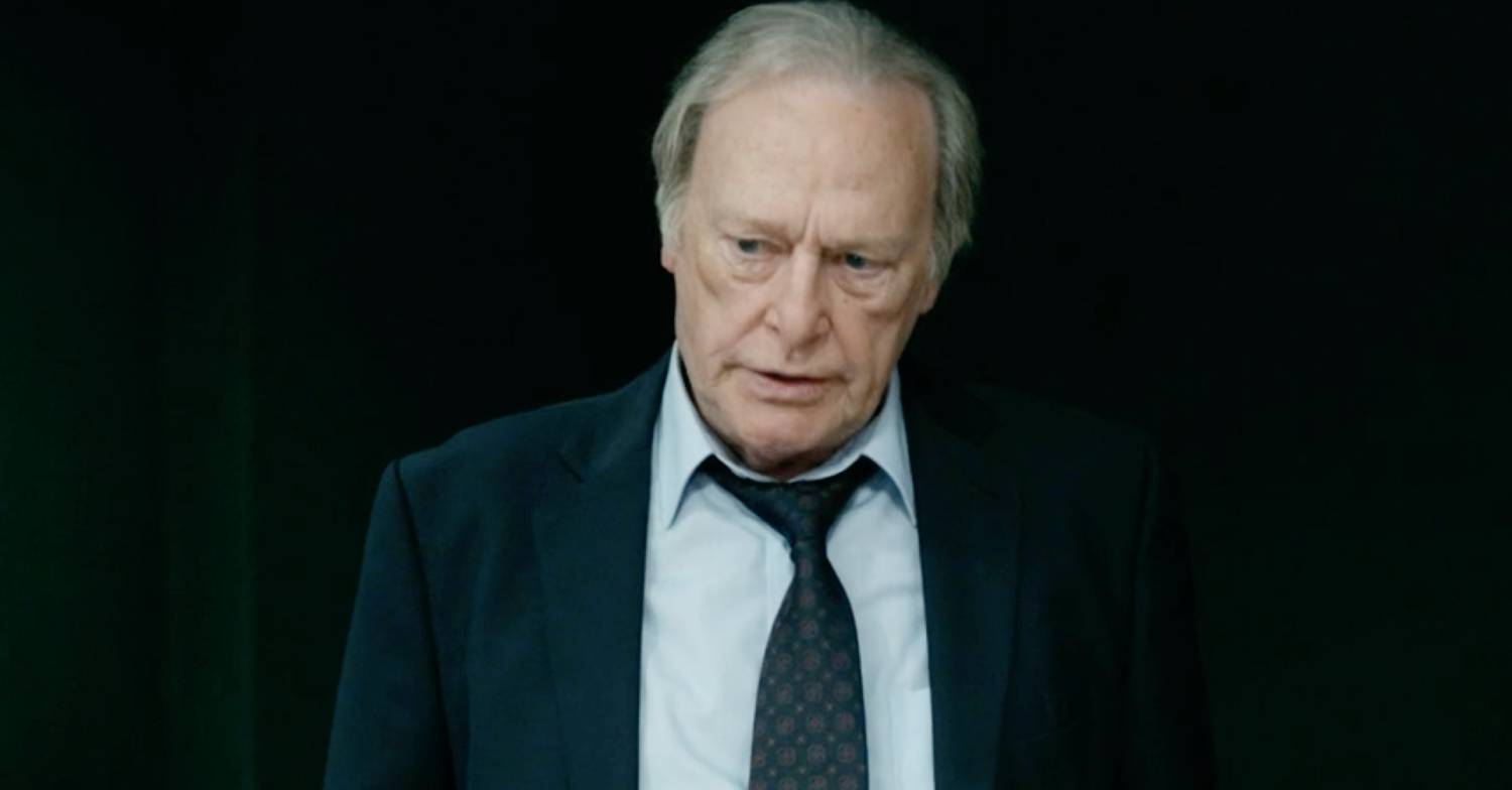 Dennis Waterman looks to the side as Gerry Standing in New Tricks