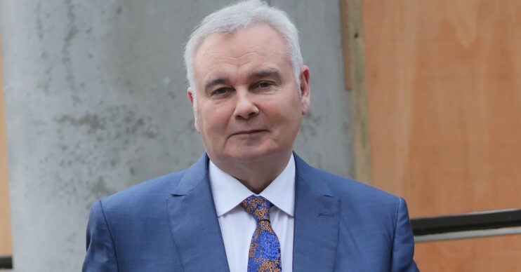 Eamonn Holmes looks serious in blue suit outside TV studios