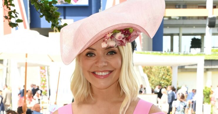 Holly Willoughby smiles in pink floral hat at Ascot today