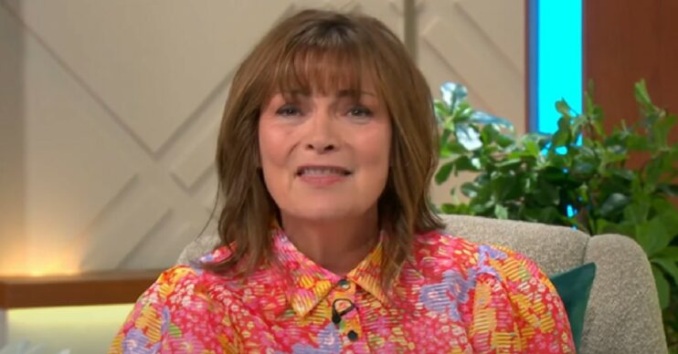 Lorraine Kelly talking to the camera in floral dress on ITV show today