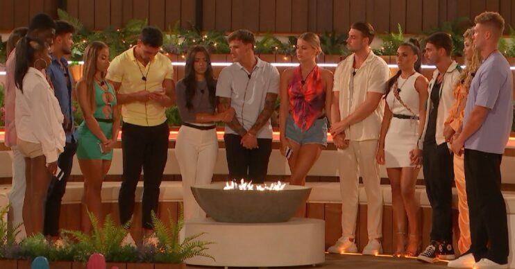 Love Island stars gathering around the firepit