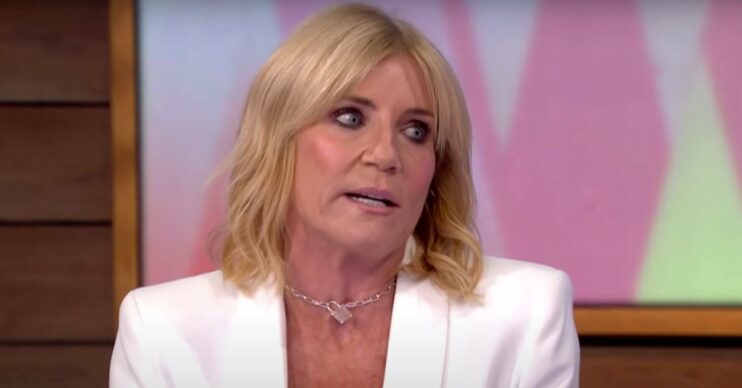 Michelle Collins explains a story during an interview
