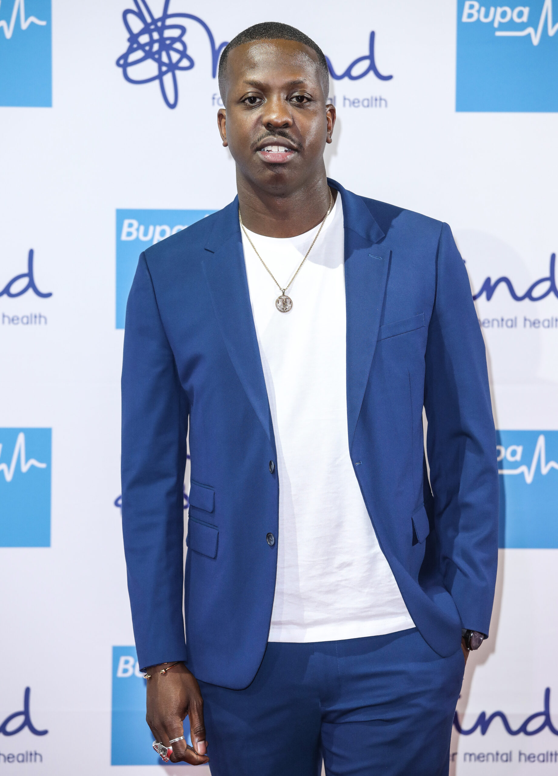 Jamal Edwards in a blue suit on the red carpet