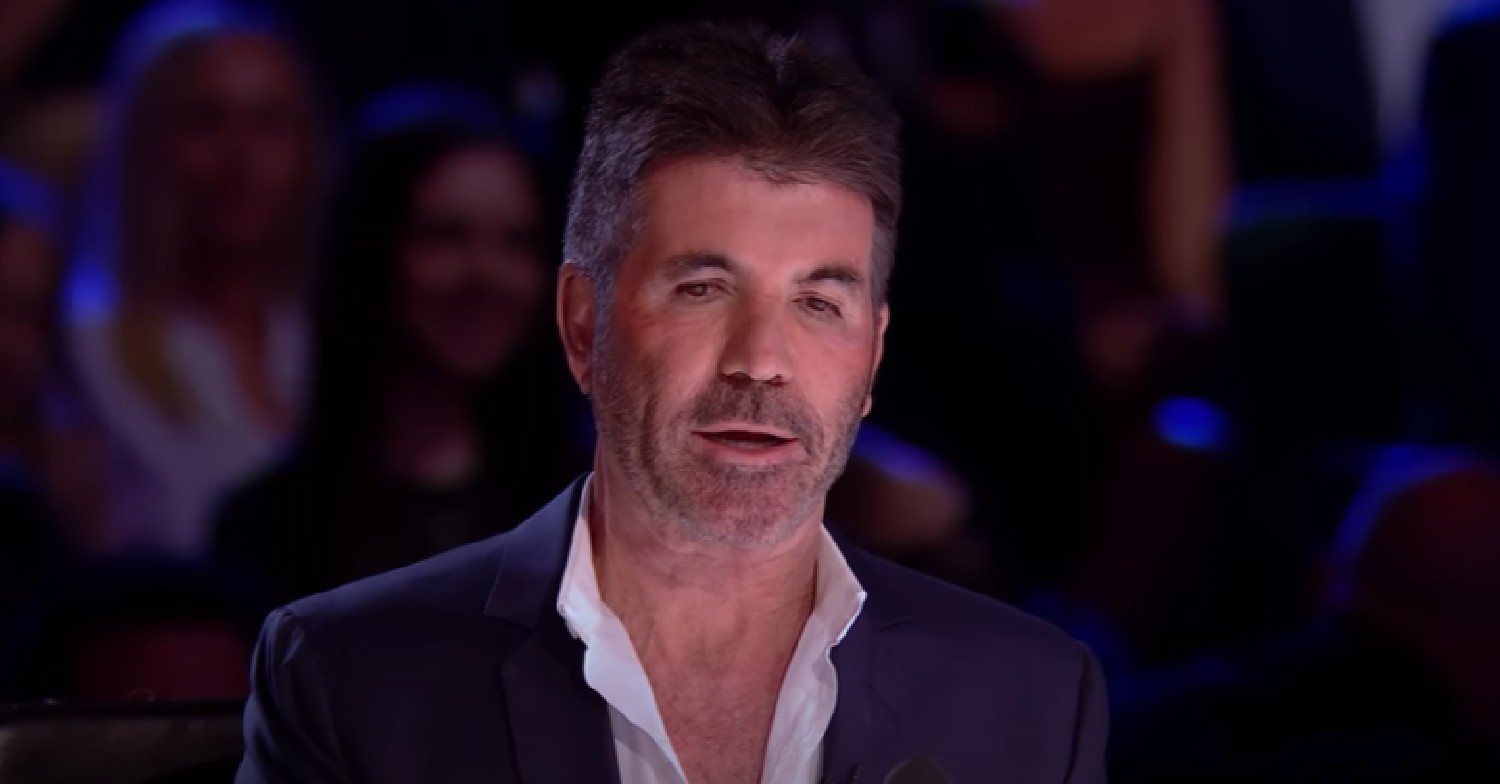 Simon Cowell looking down as he speaks during BGT final