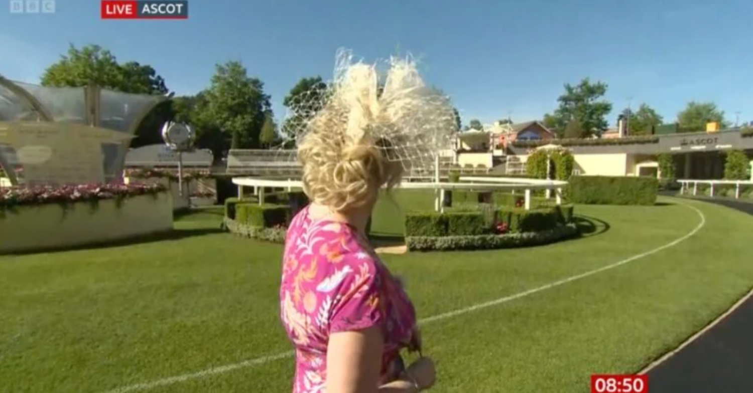 Carol turns her head while wearing a hat