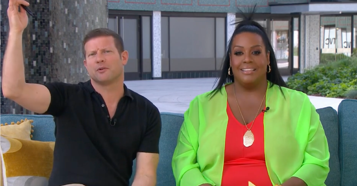 Dermot O'Leary lifting his arm in the air while Alison Hammond smiles on This Morning today