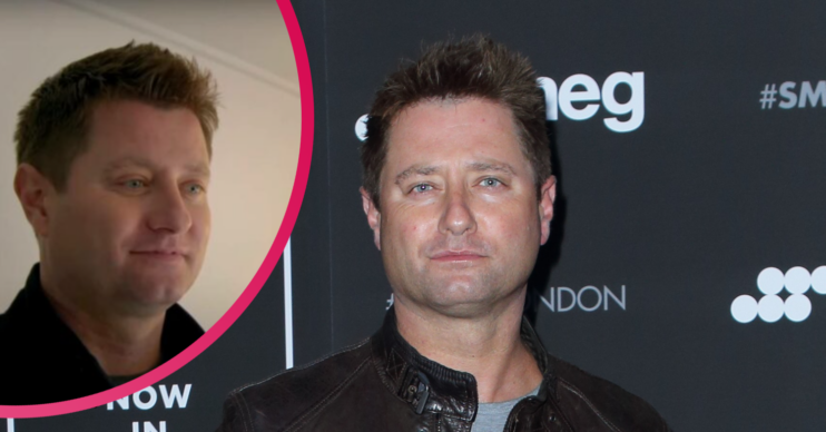 George Clarke posing on the red carpet
