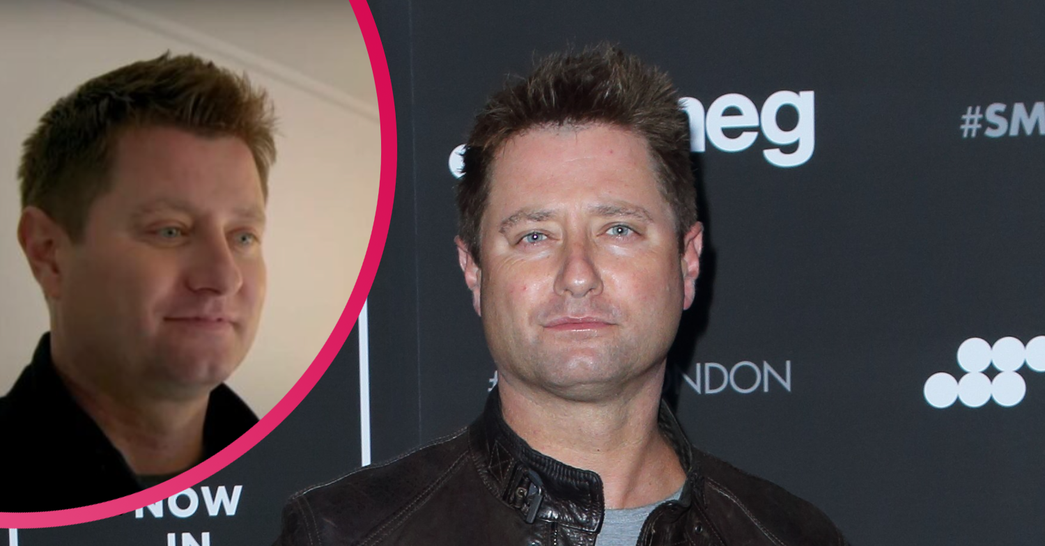 George Clarke posing on the red carpet