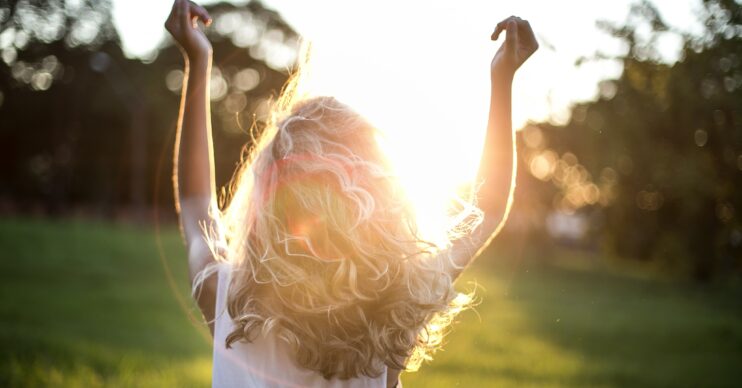 A girl dancing in the sunshine
