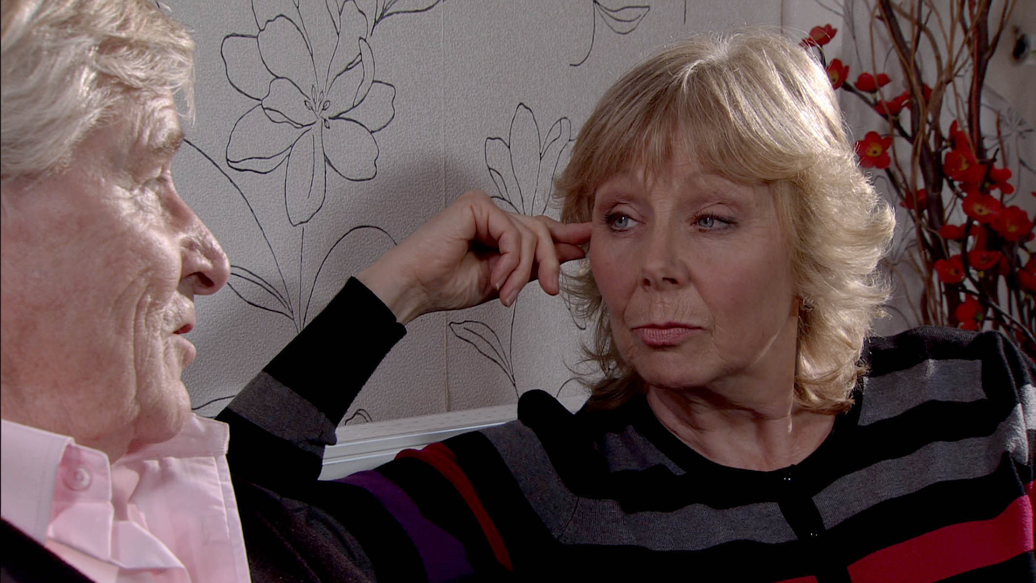 Coronation Street Ken Barlow and Wendy Crozier on the sofa looking serious