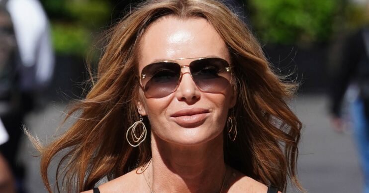 Amanda Holden in a summer dress outside Global