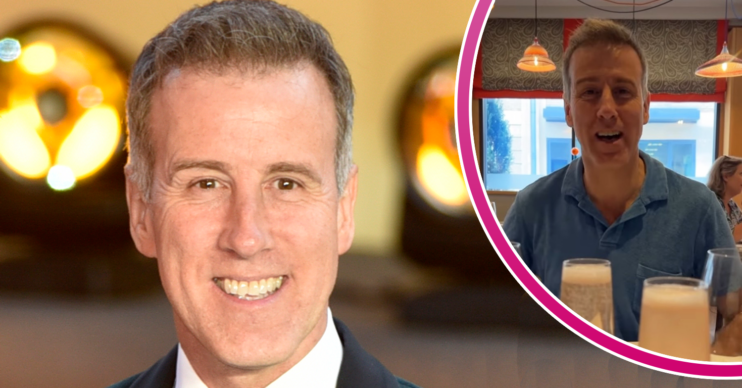 Anton du Beke smiling and having a glass of champagne