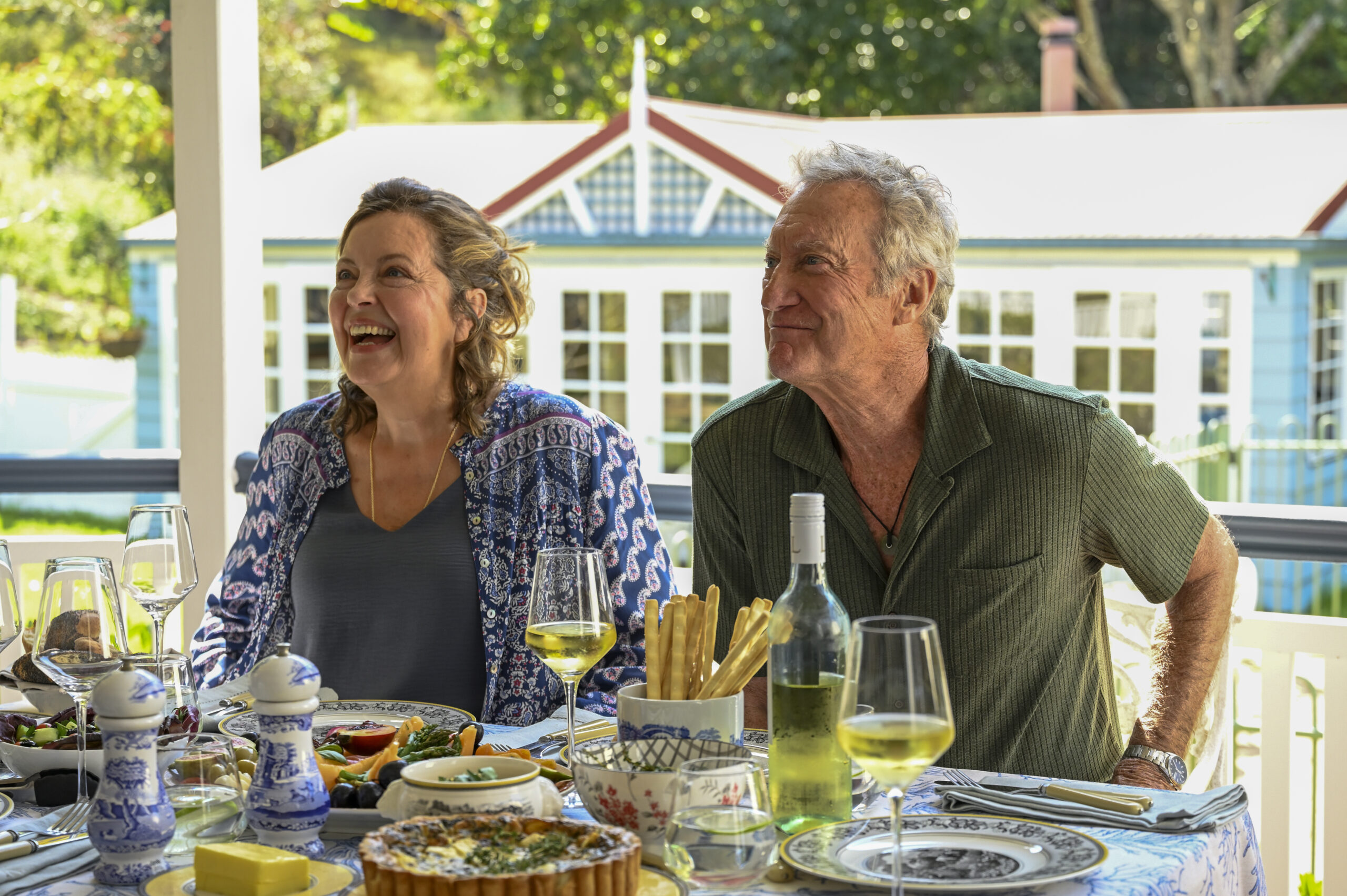 Darby and Joan smile over drinks and dinner