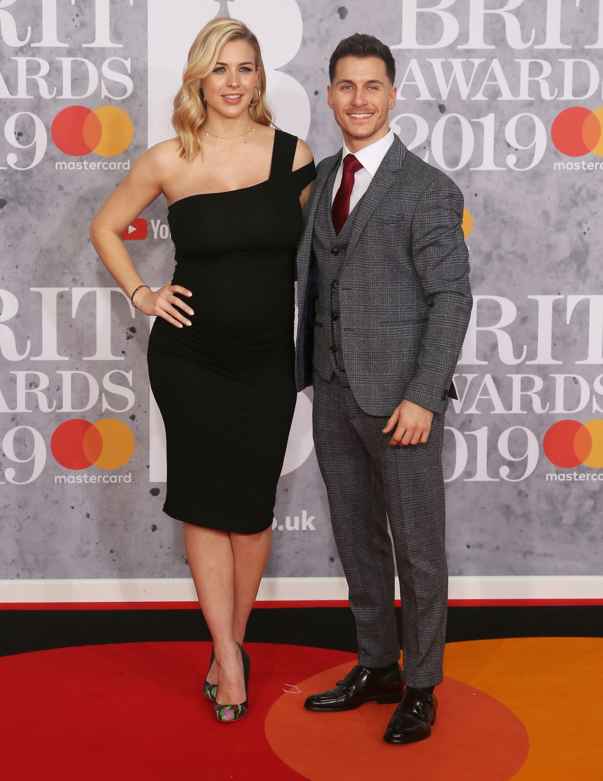 Gemma Atkinson and Gorka Marquez smile on red carpet at BRIT Awards