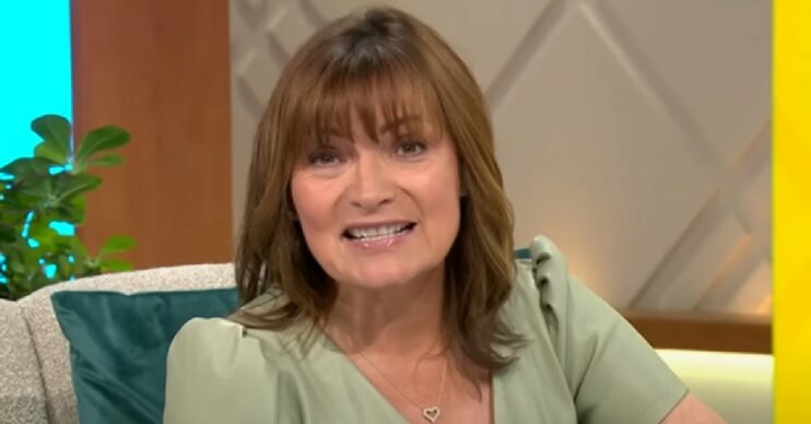 Lorraine Kelly smiling and talking to the camera on her show