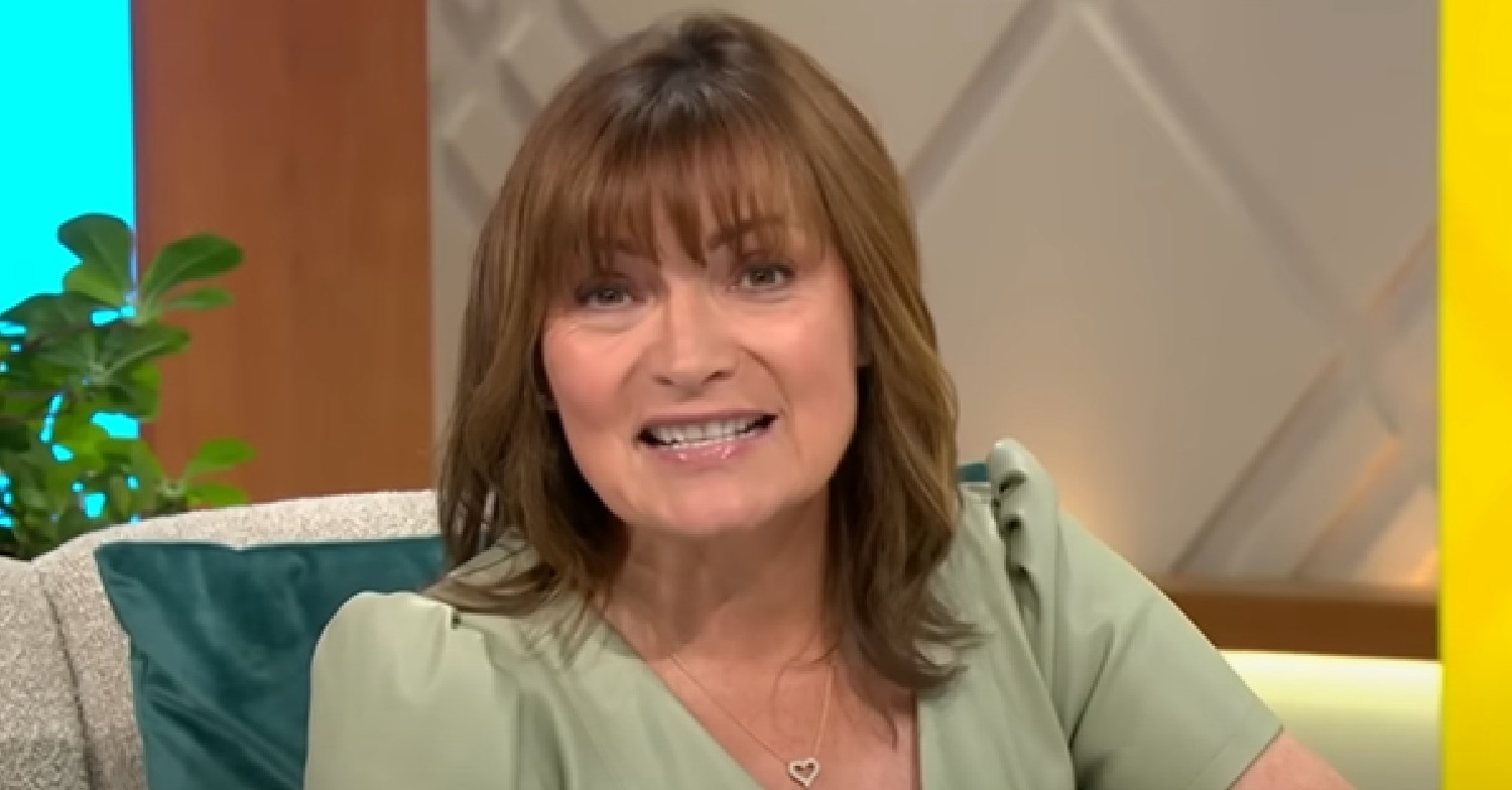 Lorraine Kelly smiling and talking to the camera on her show