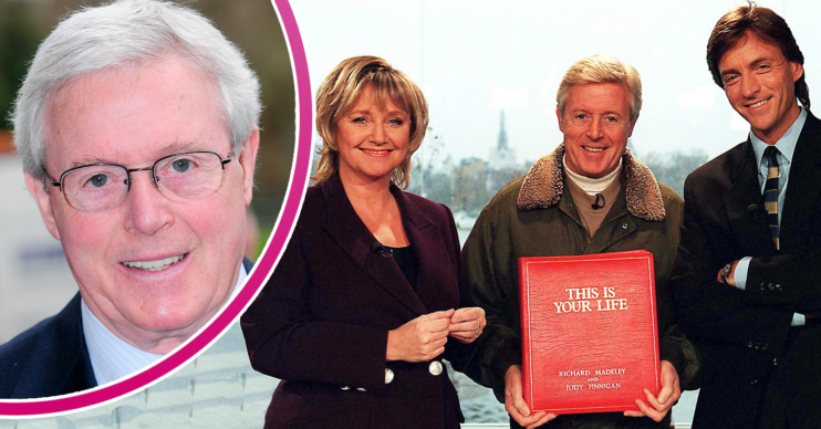 Michael aspen holding his big red book with Richard and Judy