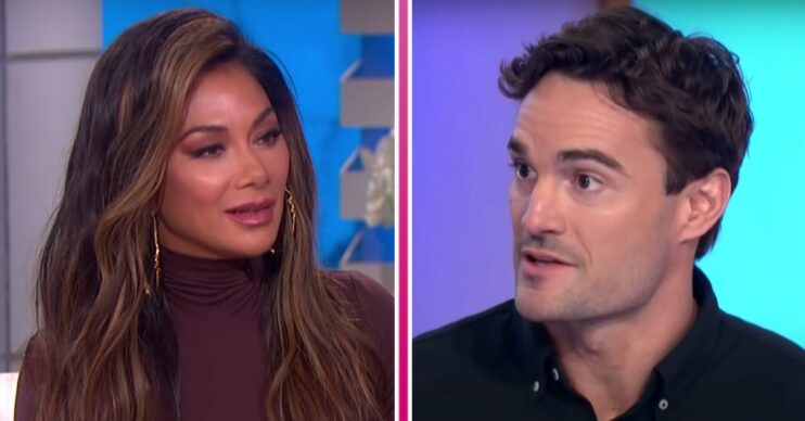Nicole Scherzinger looks to her left and Thom Evans looks to his right