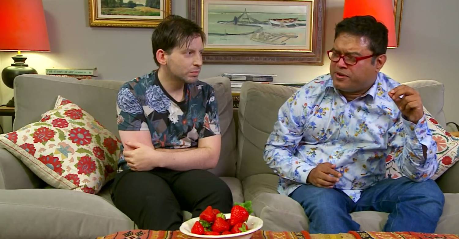 Paul Sinha enjoys a strawberry alongside husband Oliver Levy on Celebrity Gogglebox