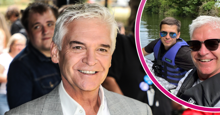 Phillip Schofield smiling with his trainer