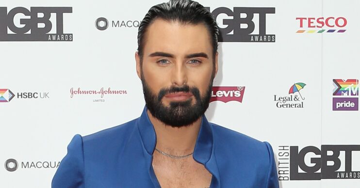Rylan Clark smoulders at camera in blue blazer