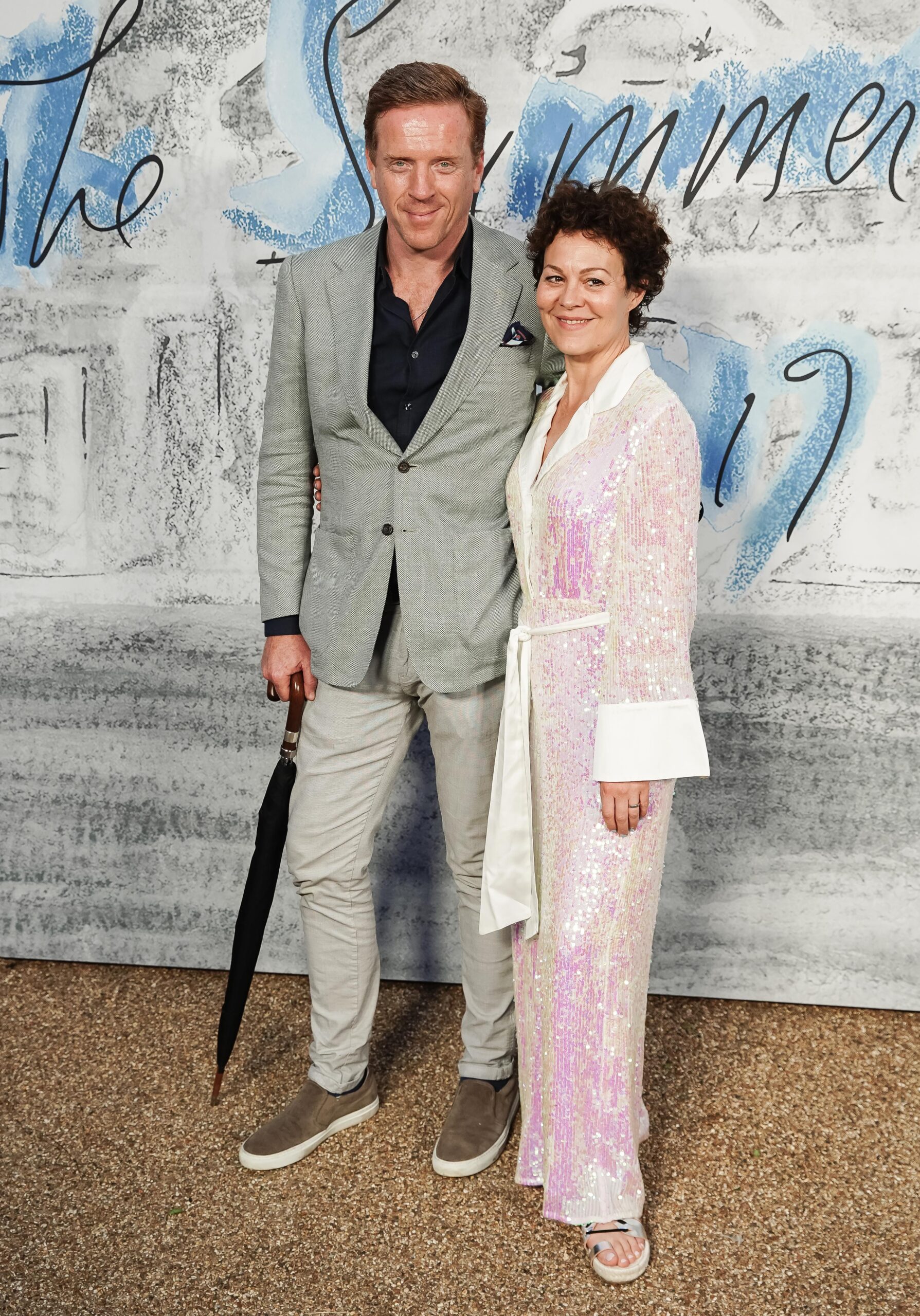Damian Lewis and Helen McCrory smiling on the red carpet