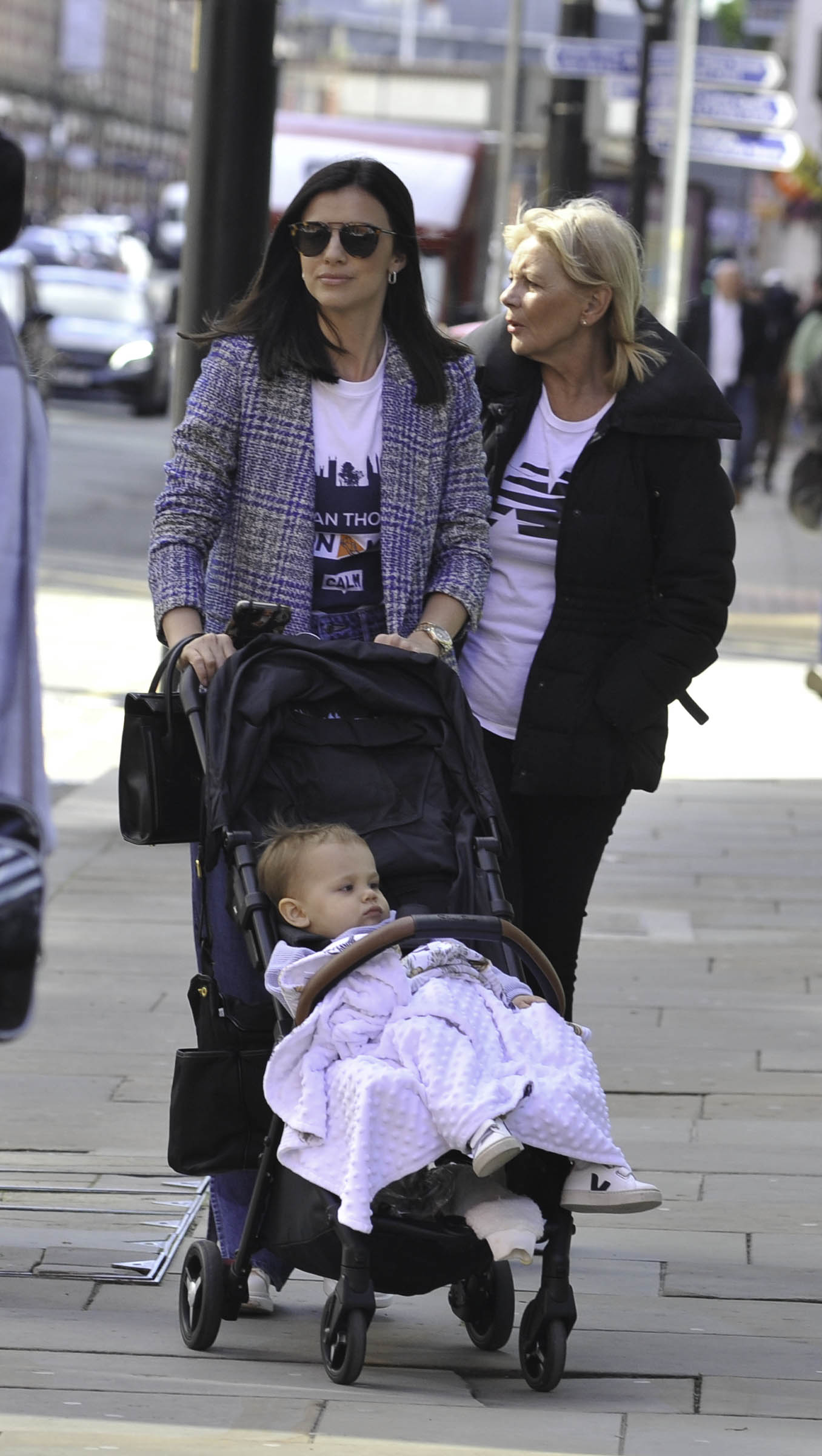 Lucy Mecklenburgh pushing roman in a pram