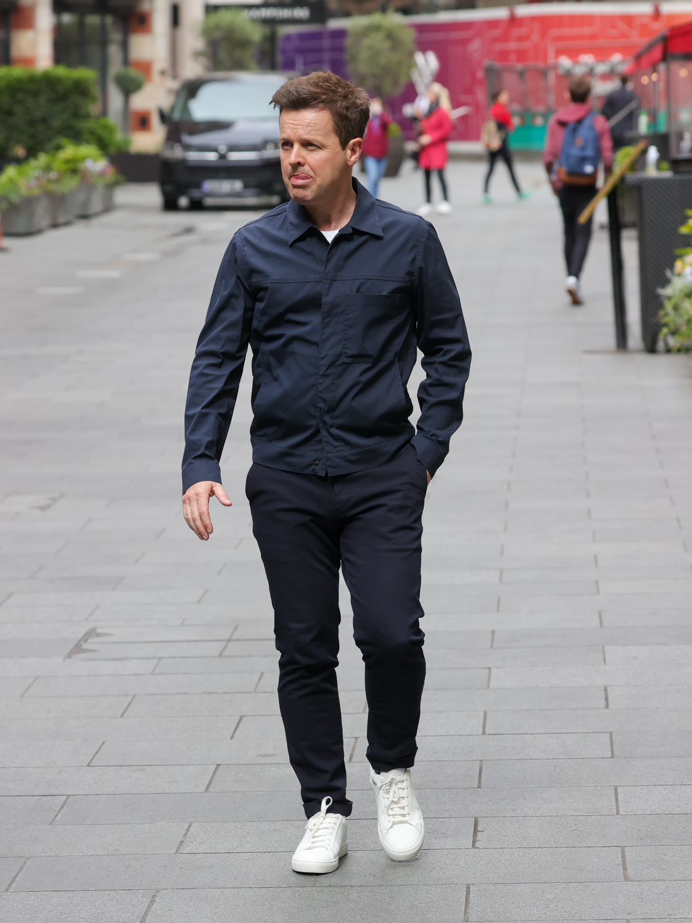 Declan Donnelly looks sad walking down the street