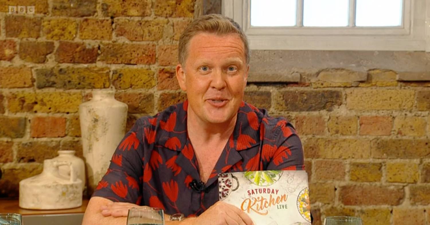 Saturday Kitchen host Olly Smith speaks while seated