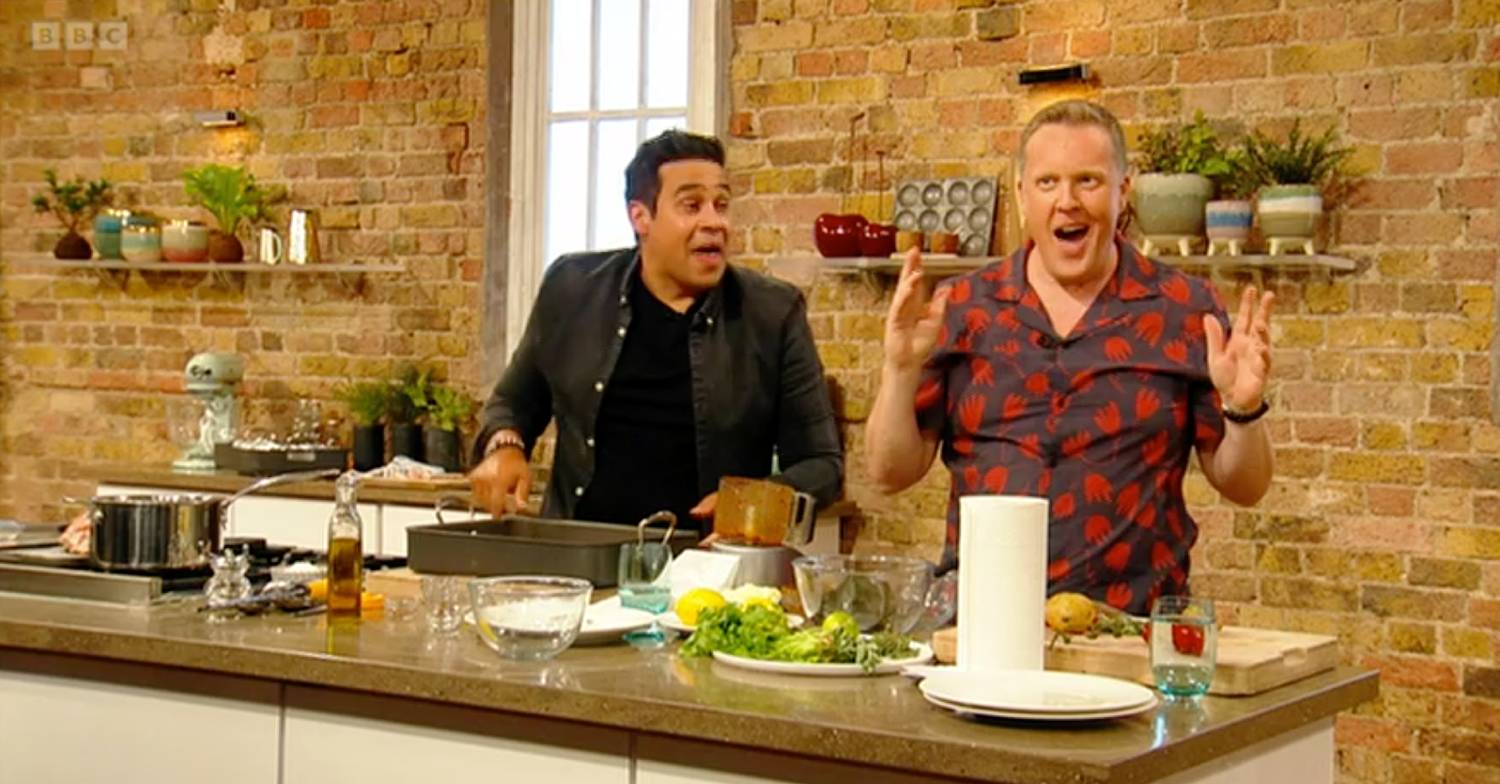 Saturday Kitchen host Olly Smith raises his hands