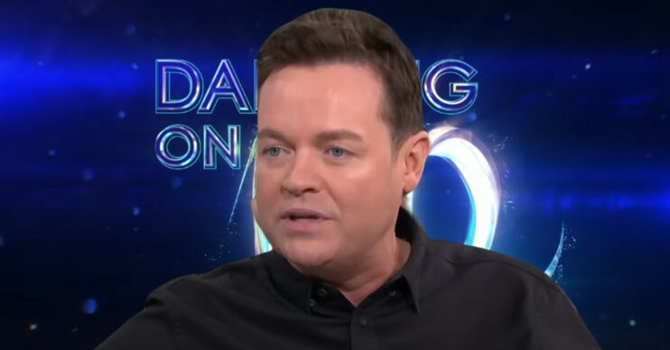 Stephen Mulhern in front of Dancing On Ice logo
