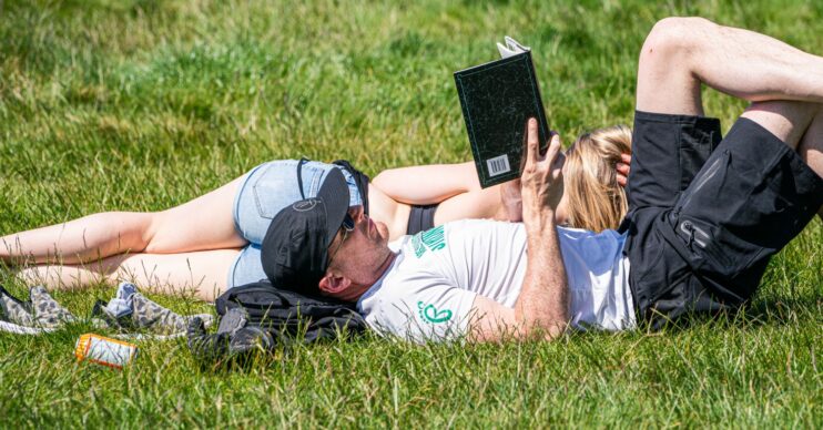 People relaxing in the sunny UK weather in London