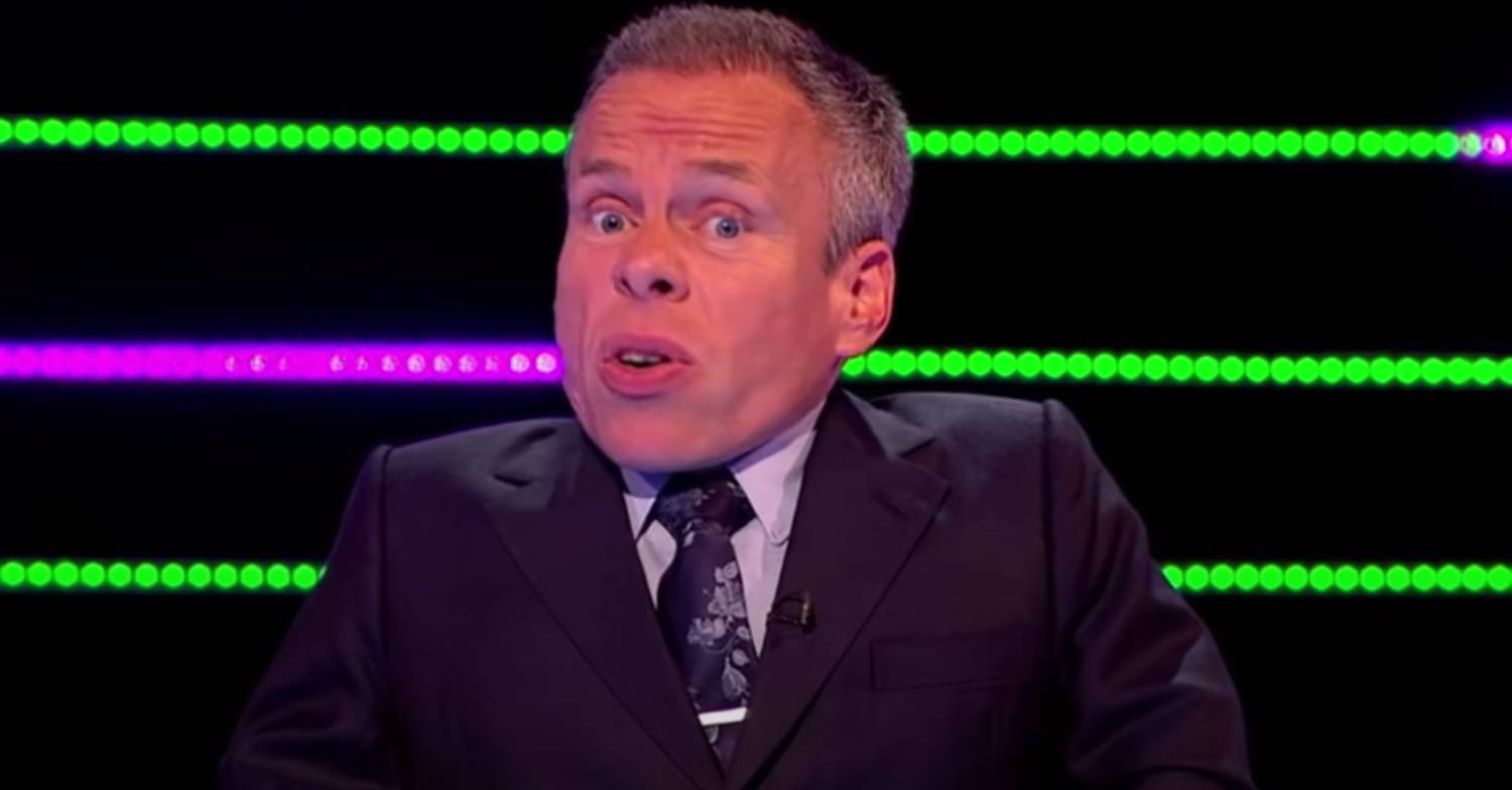 Warwick Davis looks animated while presenting Tenable