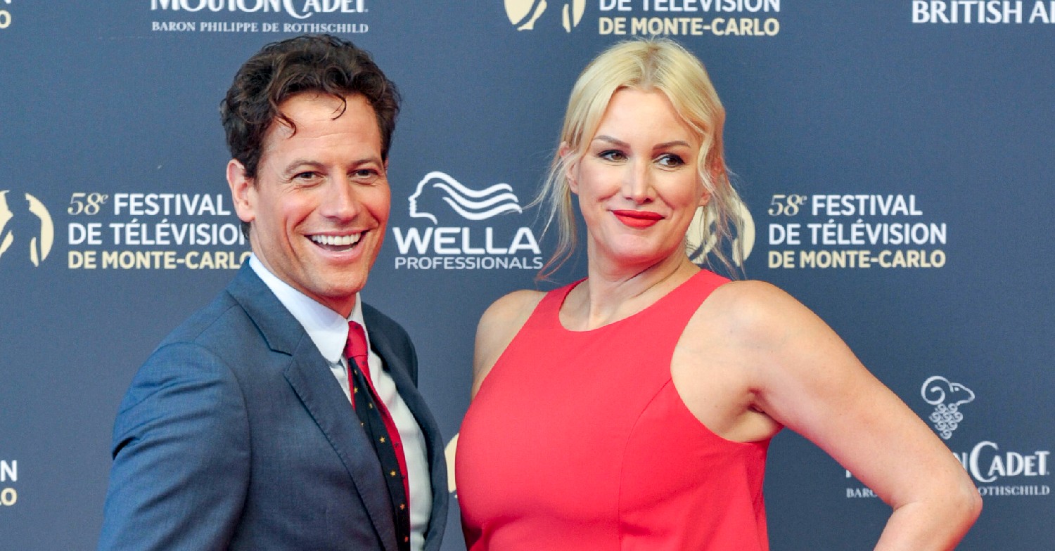 Ioan Gruffudd and Alice Evans smiling at event
