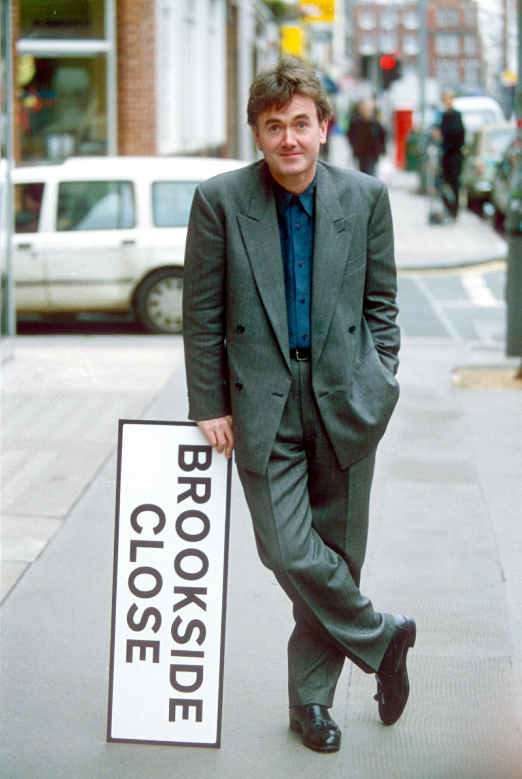 Bryan Murray standing next to a Brookside sign