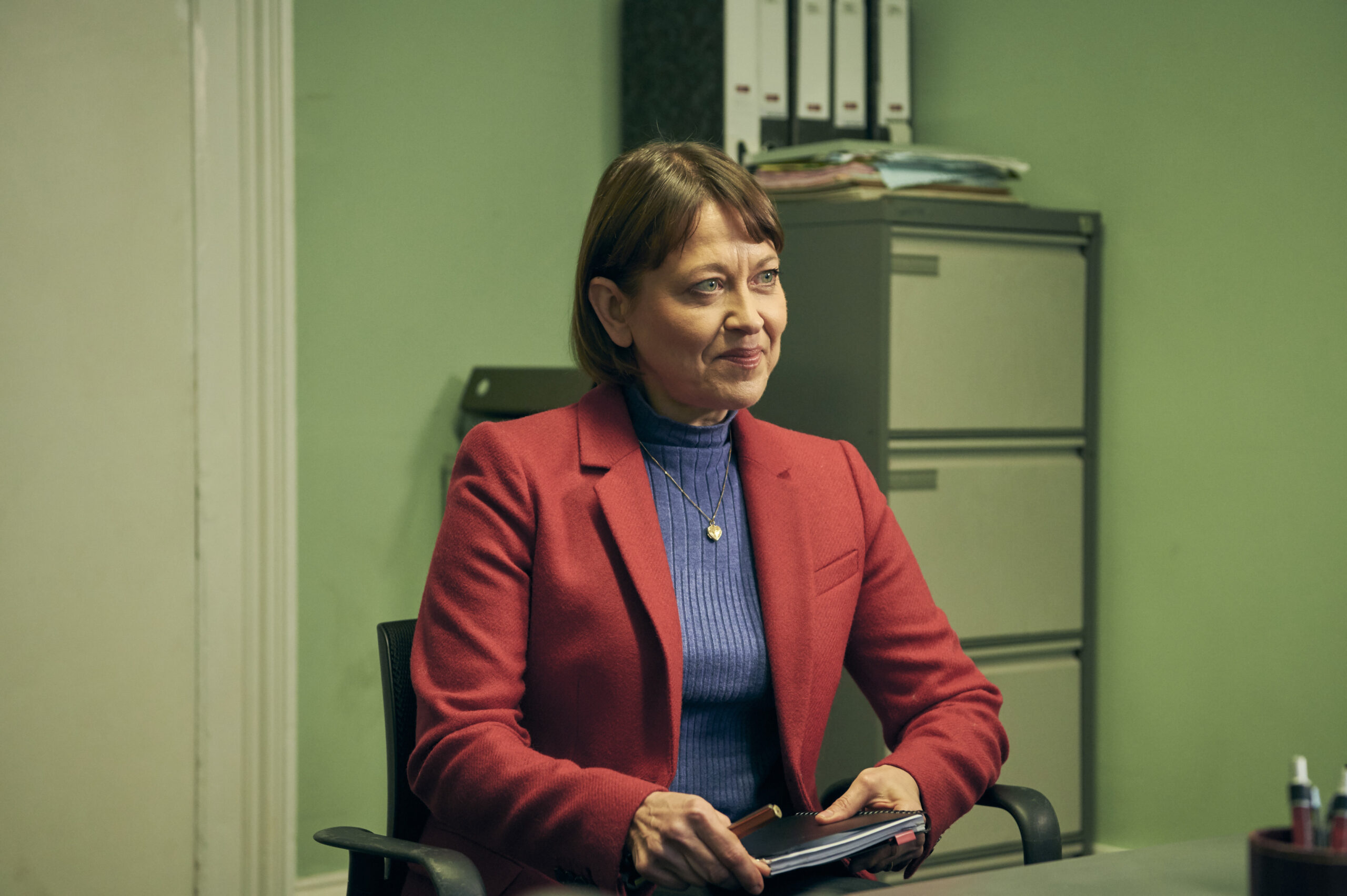 Nicola Walker as Emma, she sits at work during an interview in Marriage on BBC One